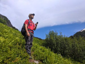 Hiker navigating with Gaia GPS