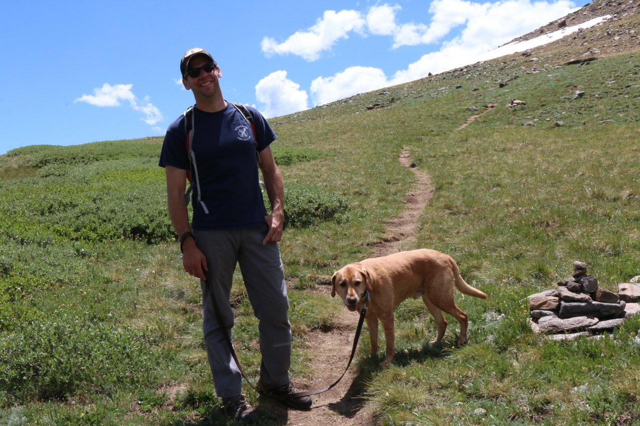 Tom with his dog hiking in Colorado