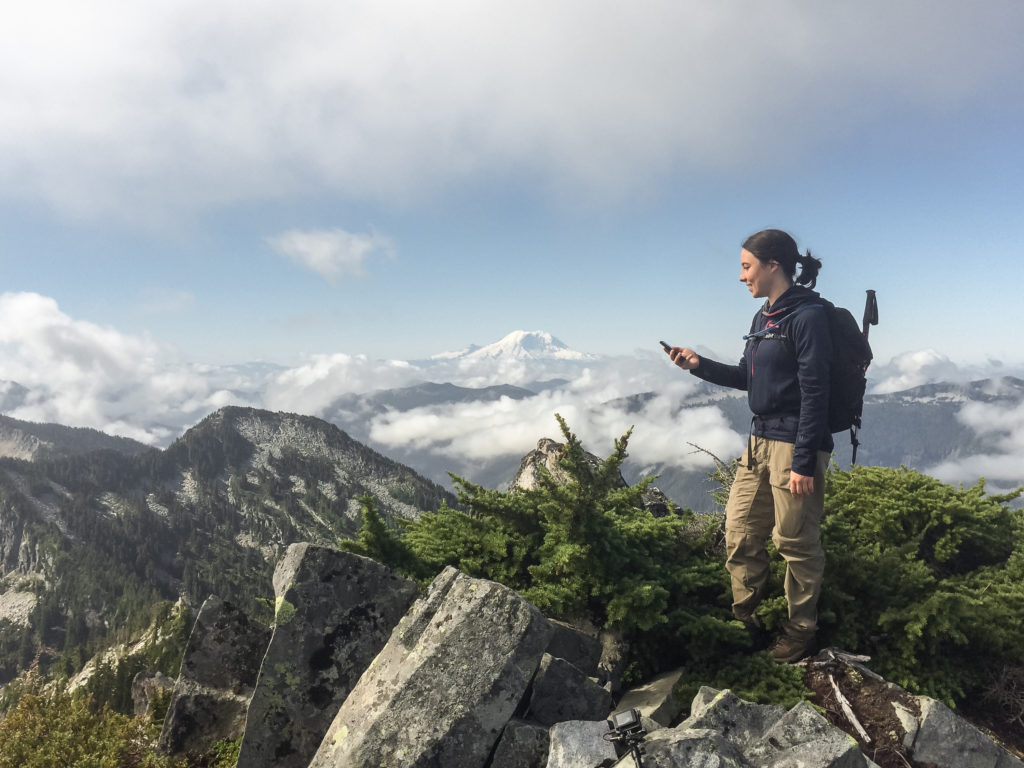 a hiker looking at her phone