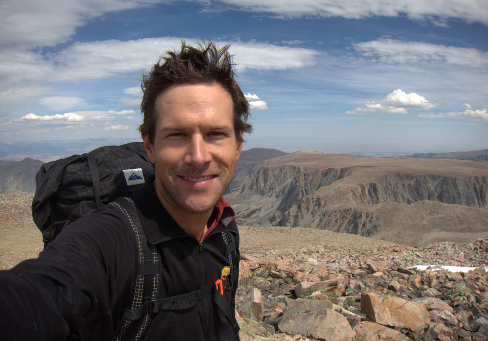 Andrew Skurka, backcountry navigation expert, with mountains in the background.