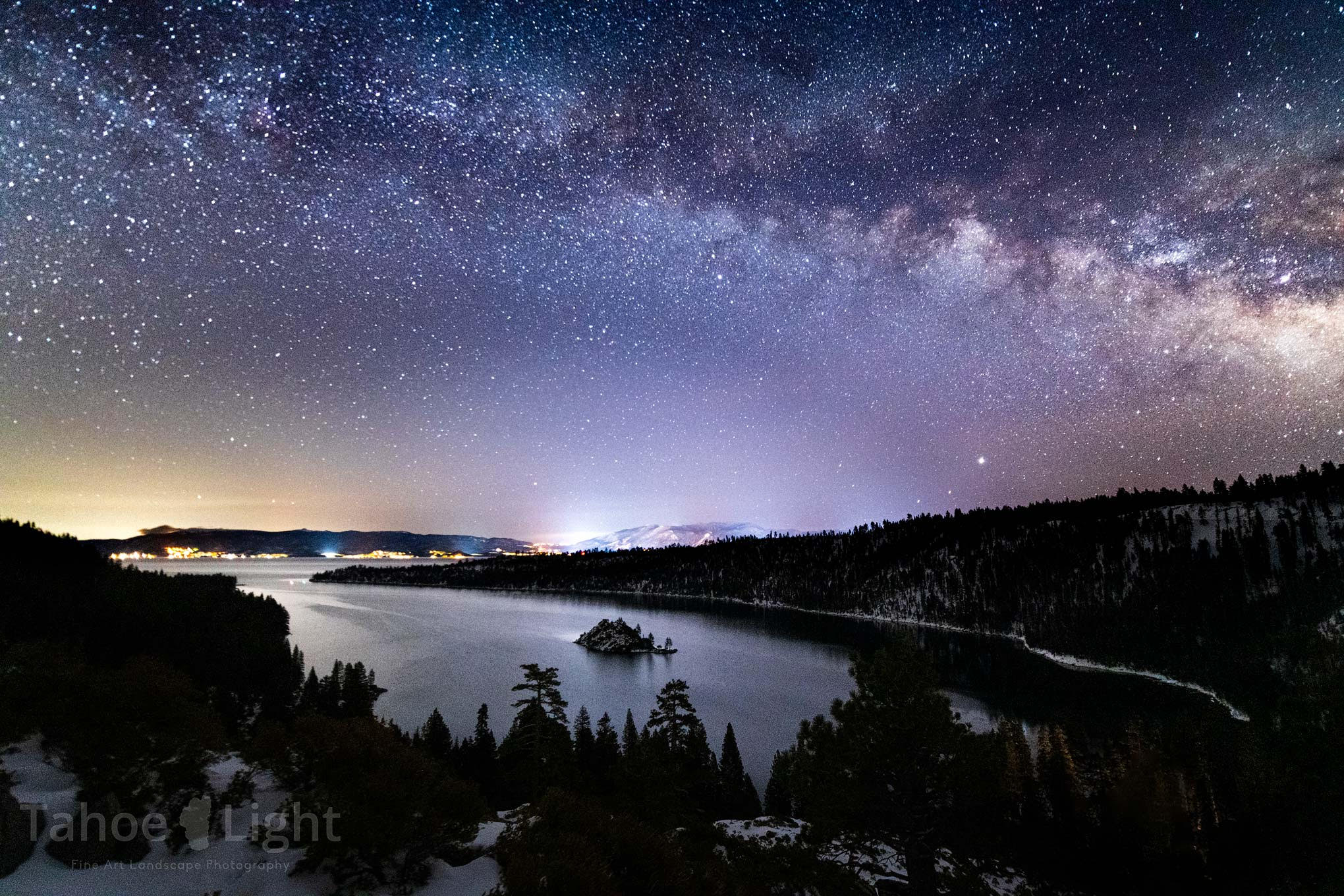 Lake Tahoe's Emerald Bay under a star-filled sky.