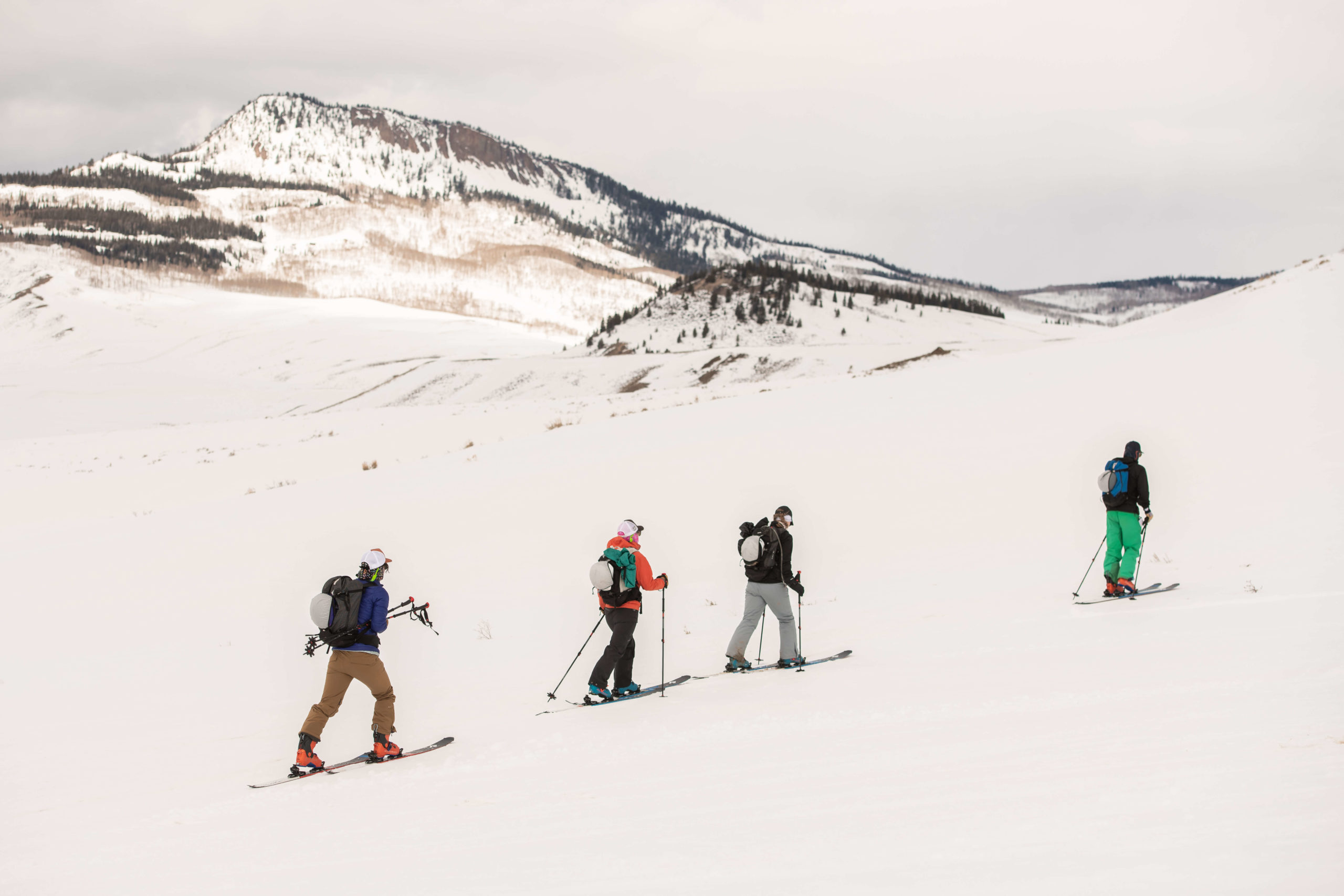 Four backcountry skiers skin up a slope outside Steamboat Springs, CO.